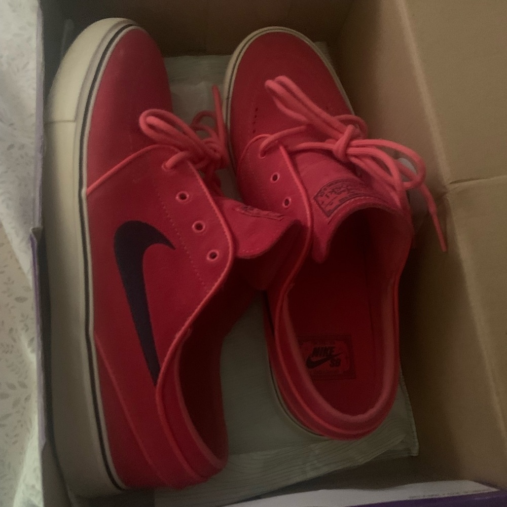 Nike Red Low-Top Sneakers with Black Swoosh